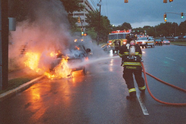 FF/EMT Ferraro extinguishes a car fire on Middlesex-Essex Turnpike September 8, 2005.