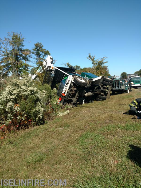 Tree trimming bucket truck flipped over ejecting the worker in the bucket Garden State Parkway 132.6 South, October 14, 2020.