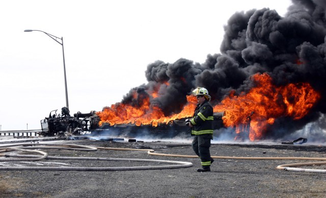 Chief Bennett at fatal gasoline tanker rollover and fire NJ Turnpike South ramp to Exit 11 March 2005.