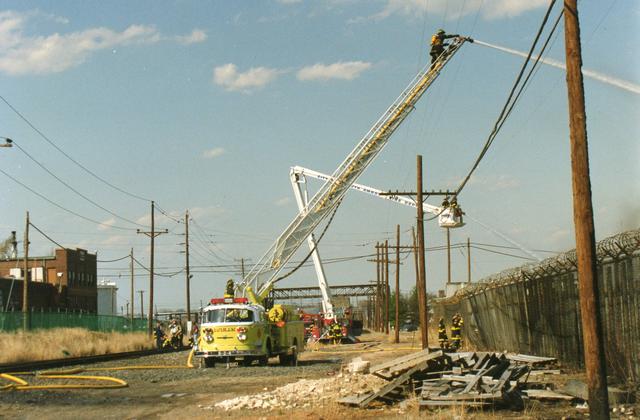 Old Truck 9-2-4 operates at a fire in Perth Amboy in the early 1990s.