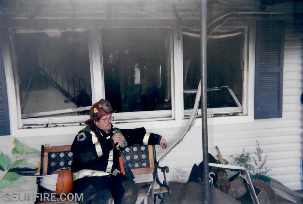 Captain Bennett relaxes after a structure fire on West Arthur Place October 2002.