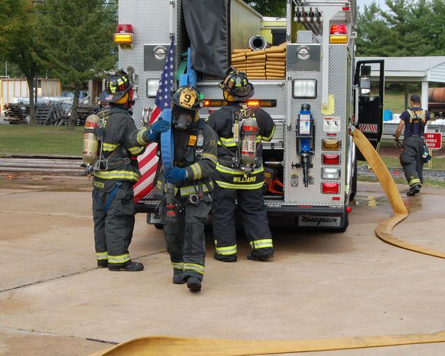 Probationary FF Motta pulls the pre-connect at a live burn drill, September 21, 2013.