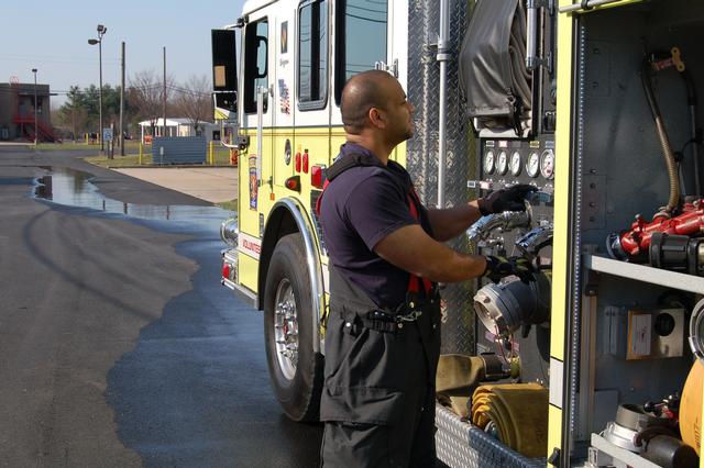 FF Saud Karim pumps at the live burn drill March 21, 2010.