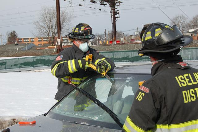 FF Lullo and FF Madison remove a windshield during extrication training February 13, 2011.