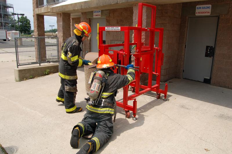 Ed Caroselli handles the axe on the forcible entry prop, June 23, 2014.