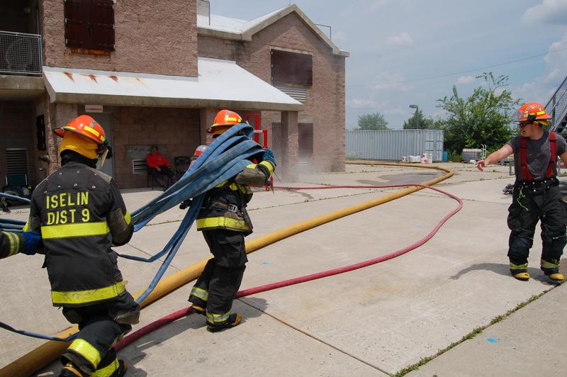 Stretching the pre-connect at Somerset Fire Academy on June 23, 2014.