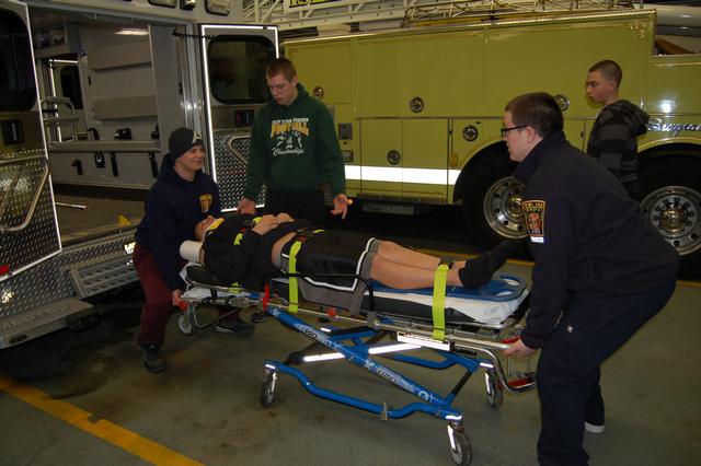 Explorers learn how to properly stabilize, package, and load a patient into an ambulance, January 2013.