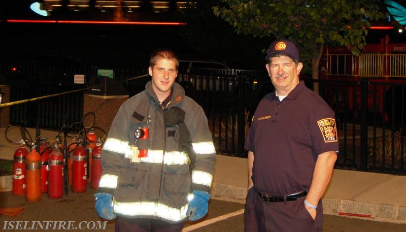 FF Conor Pirozzoli and Ex-Chief Brian Bennett set up the fire extinguisher demo at Fire Prevention Week Open House, October 7, 2015.