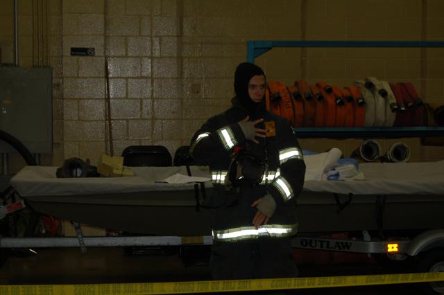 Probationary FF Joe Pickard dons his turnout gear at the open house, October 11, 2013.