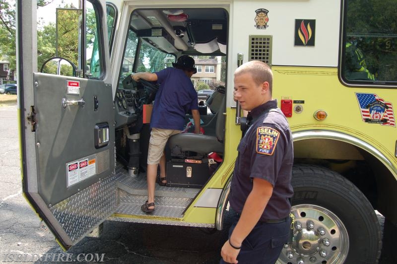 FF/EMT Creighton shows off the ladder truck for the Iselin Library Book Club, August 19, 2015.